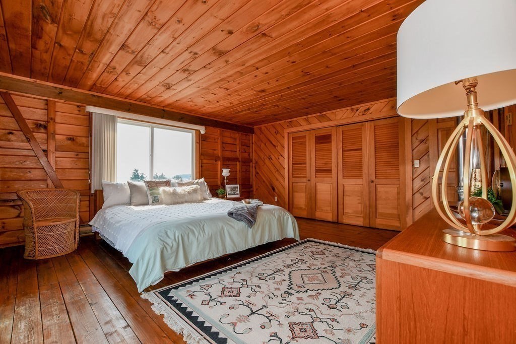 14 Sias Point Road Wareham, MA 02532 - Photo 29 of 42 a bedroom with a bed and wooden floor