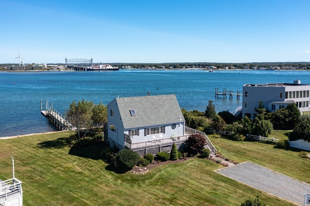 14 Sias Point Road Wareham, MA 02532 - Photo 3 of 42 a view of a lake with a terrace