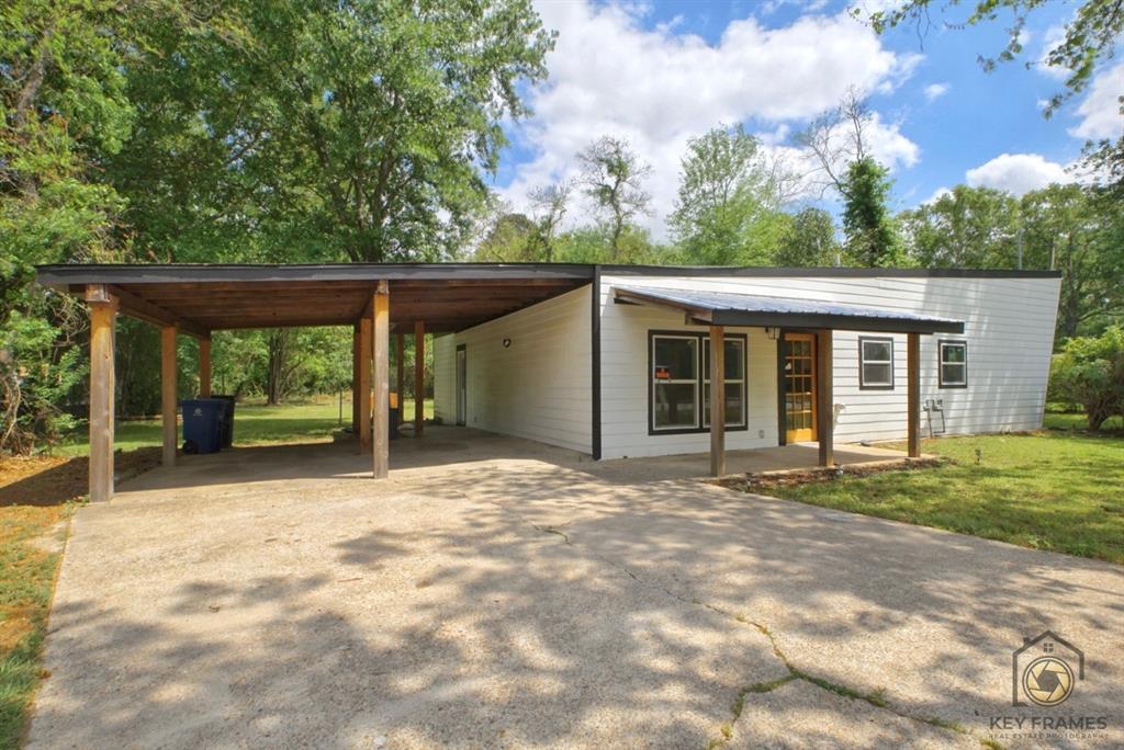 a house with trees in the background