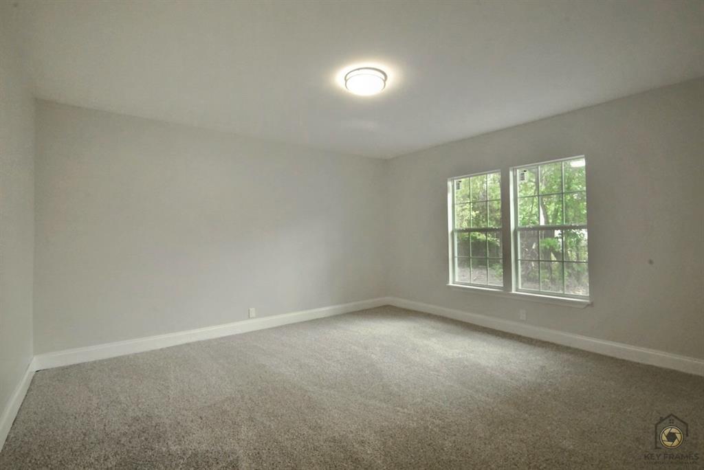 9227 Walker Road Shreveport, LA 71118 - Photo 12 of 16 an empty room with a window