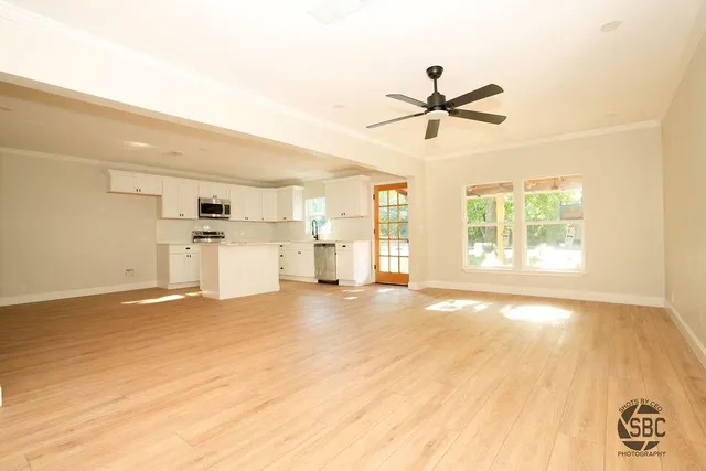 a view of a kitchen with a stove cabinets and a ceiling fan
