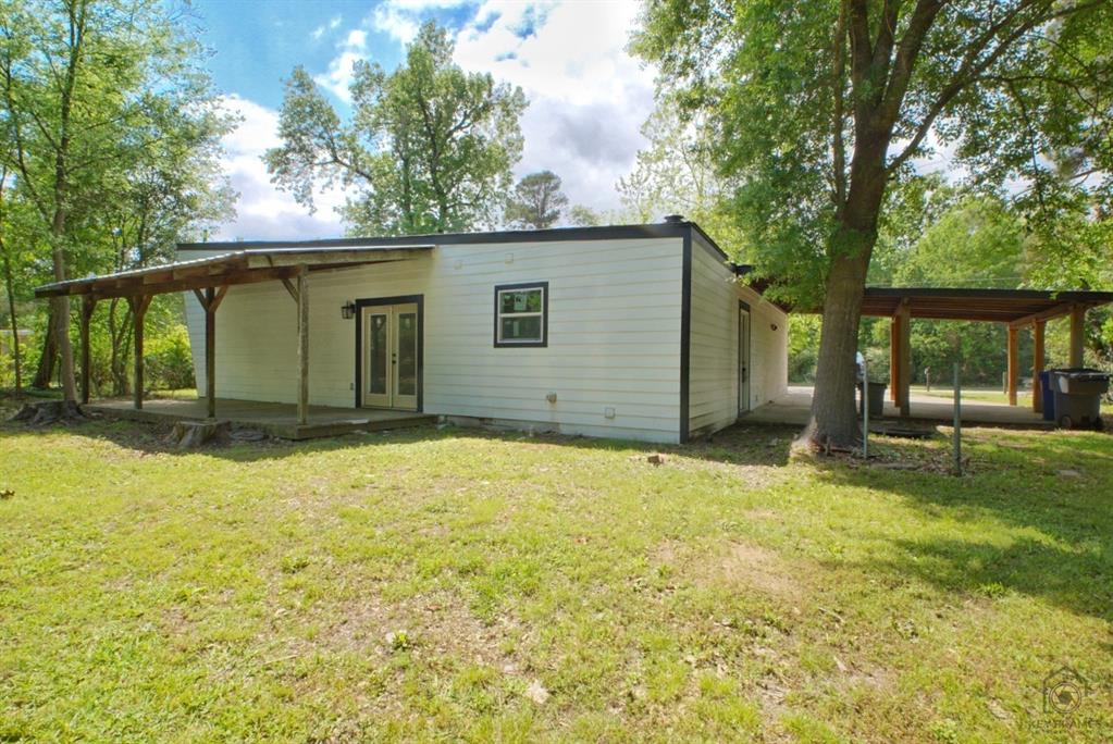 9227 Walker Road Shreveport, LA 71118 - Photo 3 of 16 a house with trees in the background