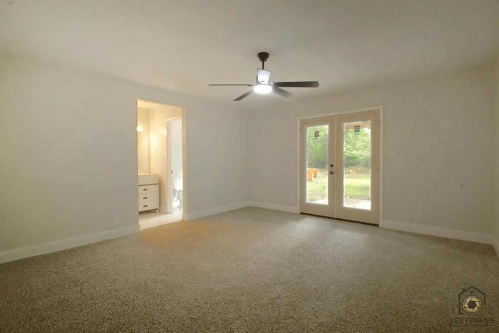 9227 Walker Road Shreveport, LA 71118 - Photo 7 of 16 a view of an empty room with a window