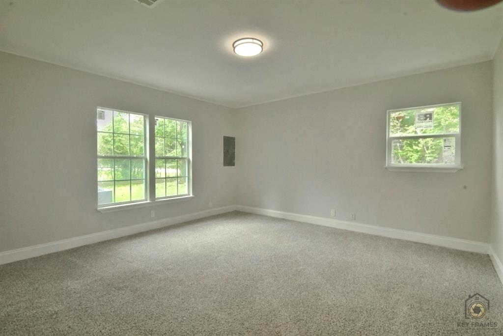 9227 Walker Road Shreveport, LA 71118 - Photo 8 of 16 an empty room with windows