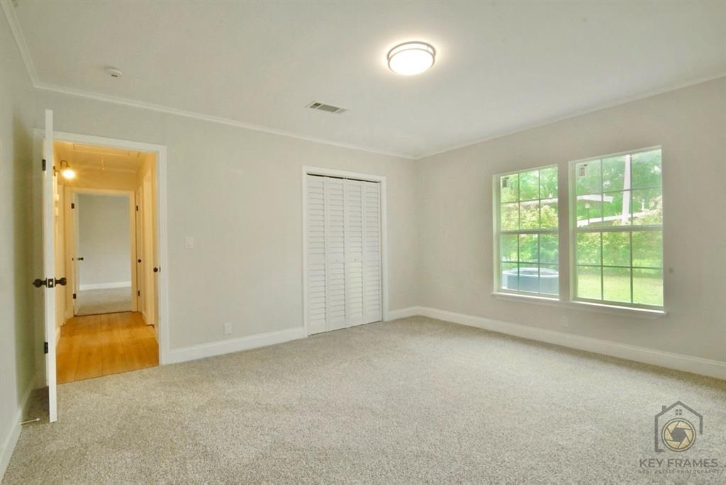 9227 Walker Road Shreveport, LA 71118 - Photo 9 of 16 an empty room with a empty space and windows