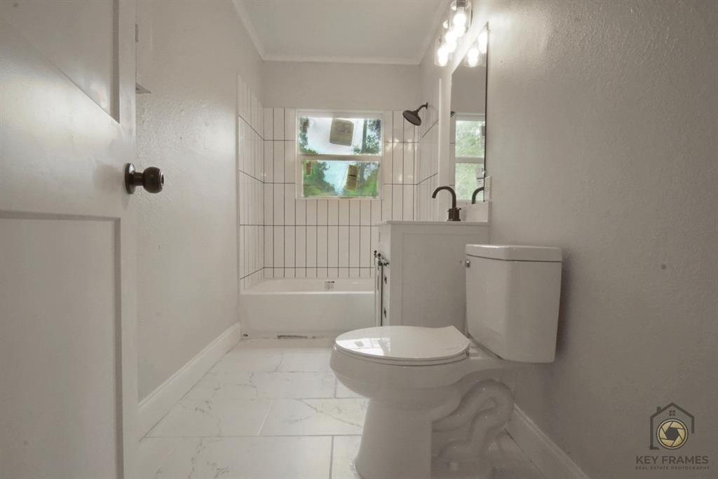 9227 Walker Road Shreveport, LA 71118 - Photo 10 of 16 a bathroom with a sink and toilet