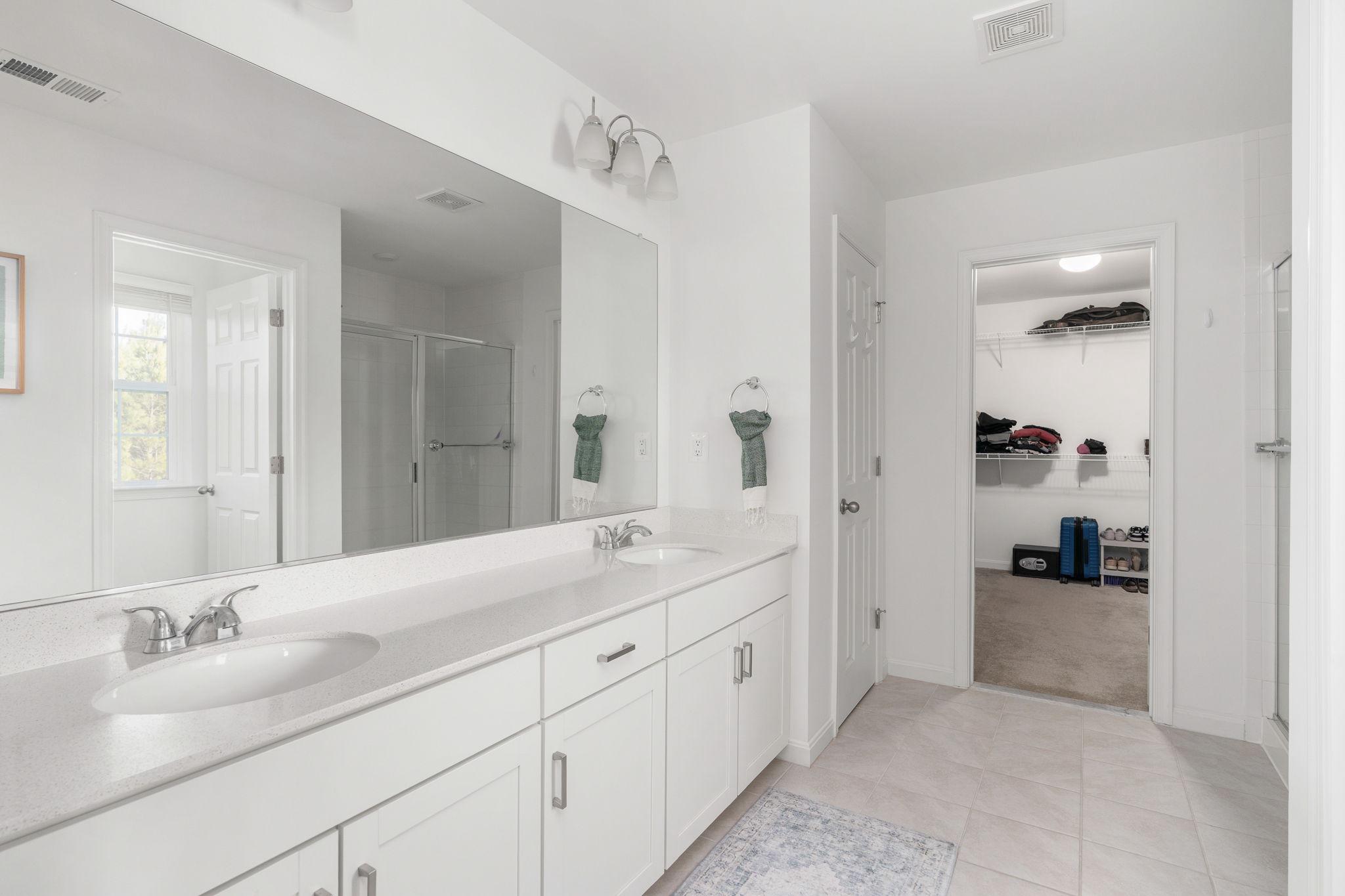 6371 Pointer Lane King George, VA 22485 - Photo 26 of 38 a spacious bathroom with a double vanity sink and mirror