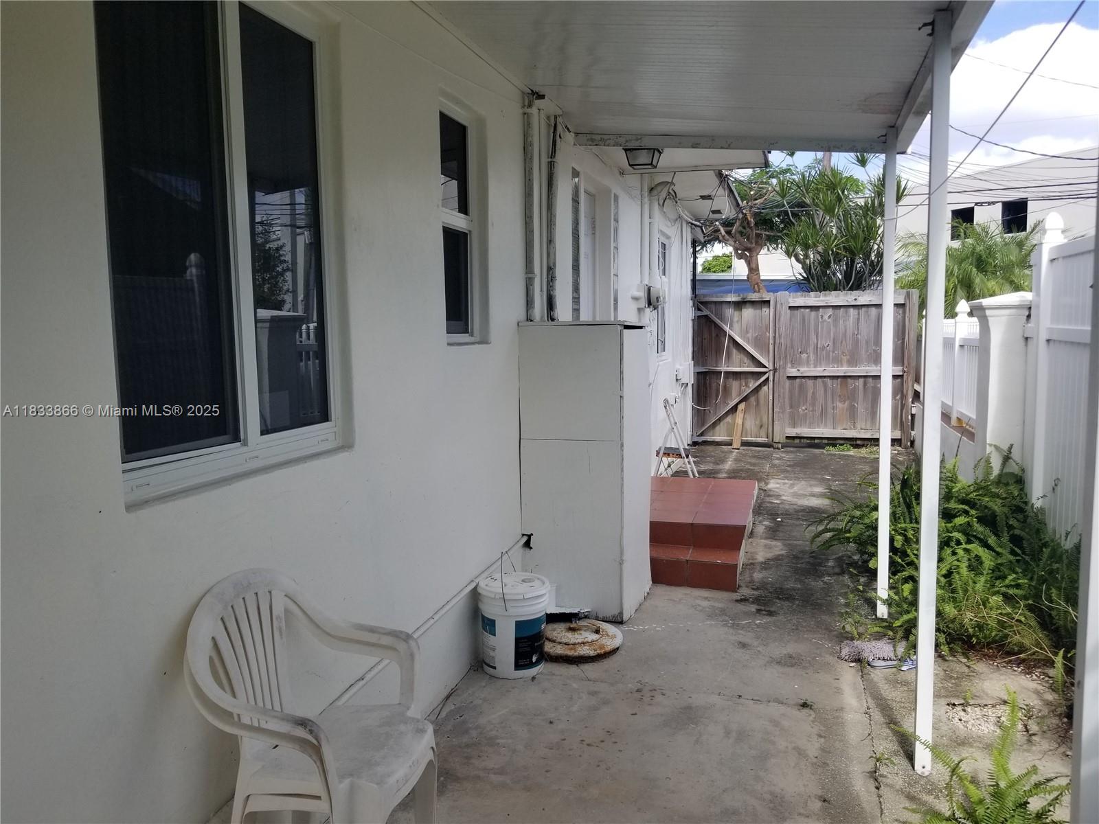 1240 Southwest 22nd Terrace, Unit 1 Miami, FL 33145 - Photo 12 of 14 a room with porch and furniture