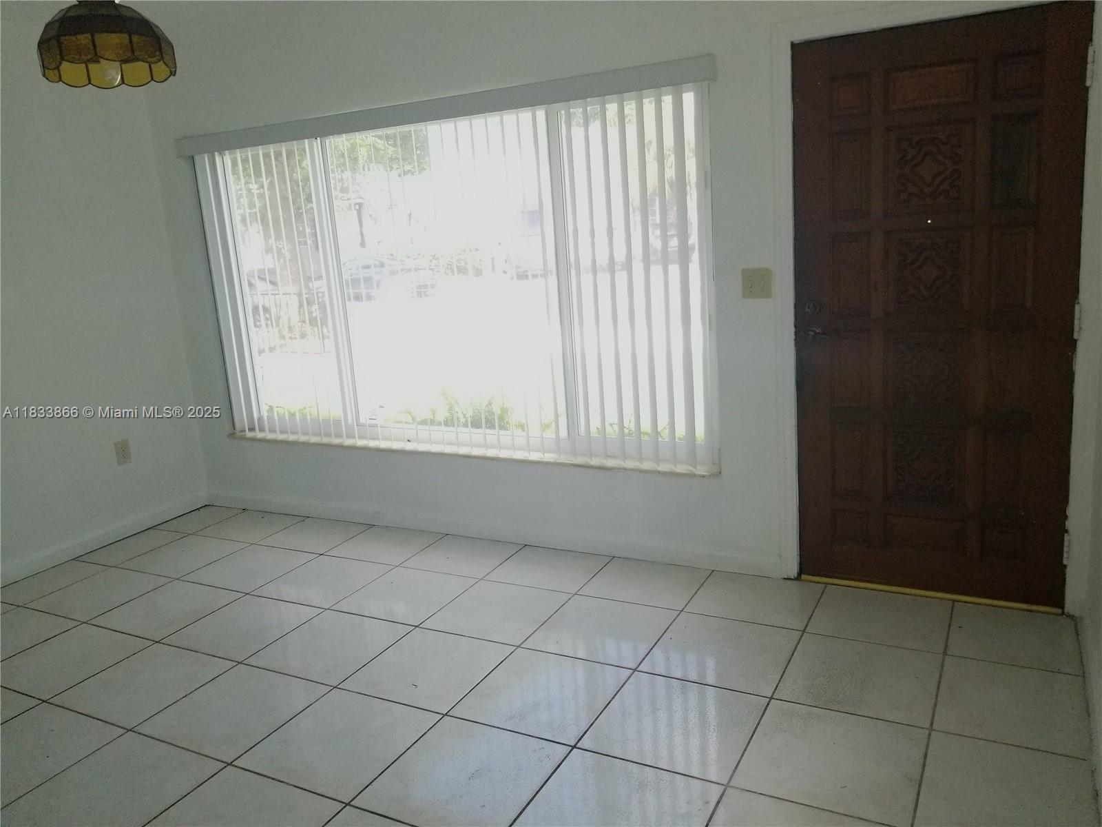 1240 Southwest 22nd Terrace, Unit 1 Miami, FL 33145 - Photo 7 of 14 an empty room with windows