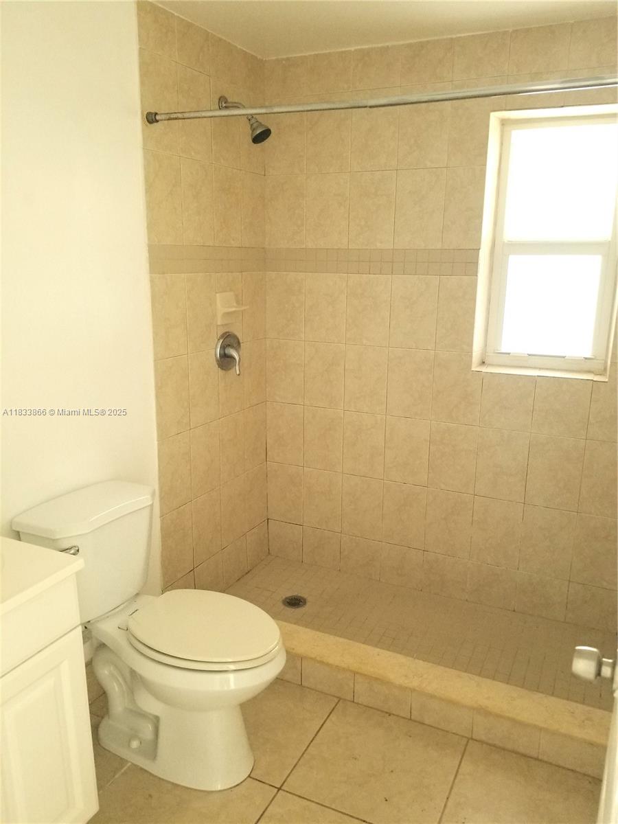 1240 Southwest 22nd Terrace, Unit 1 Miami, FL 33145 - Photo 10 of 14 a bathroom with a toilet and shower