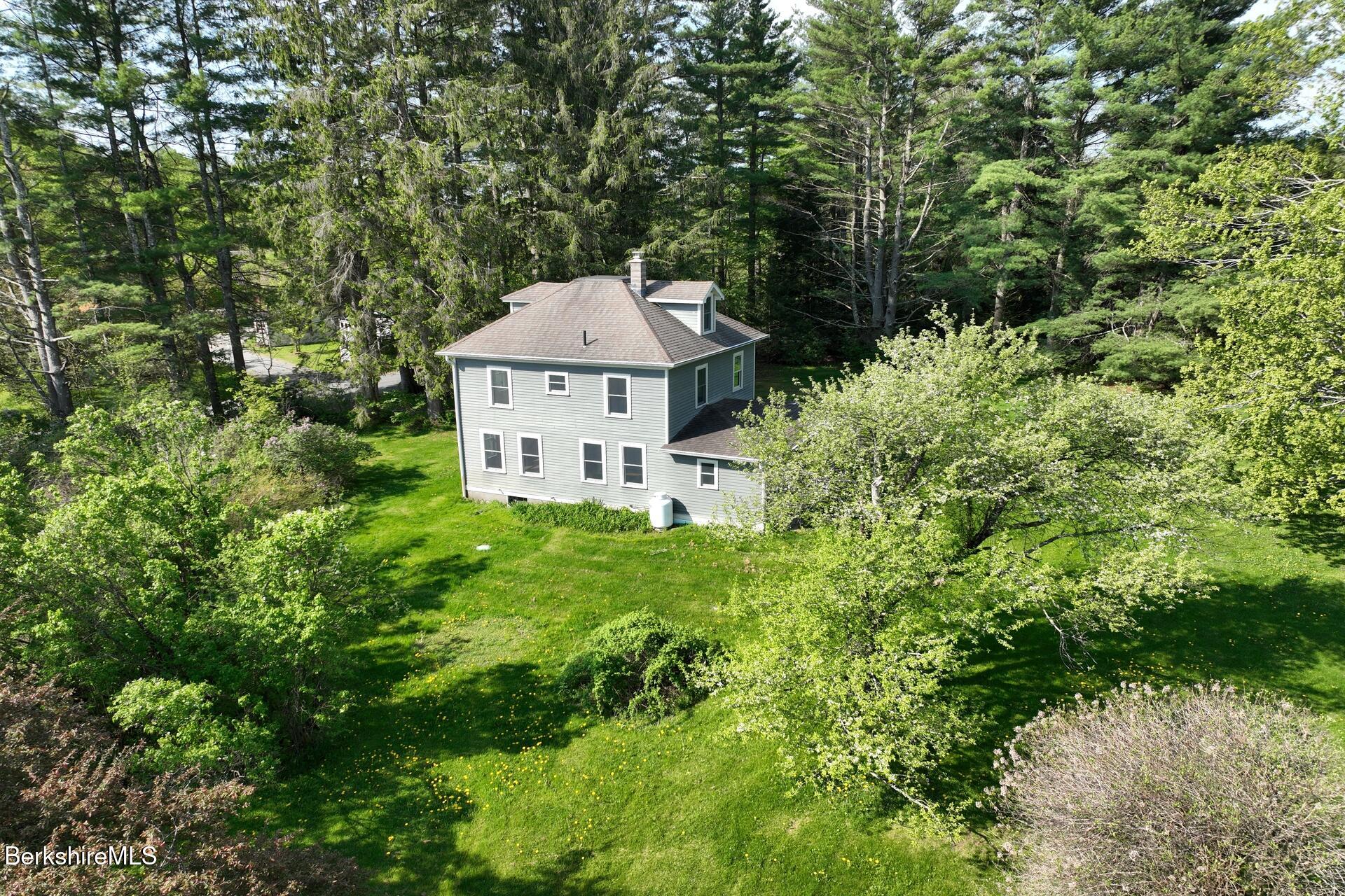 86 Miner Road Lanesborough, MA 01237 - Photo 9 of 44 a front view of a house with a yard