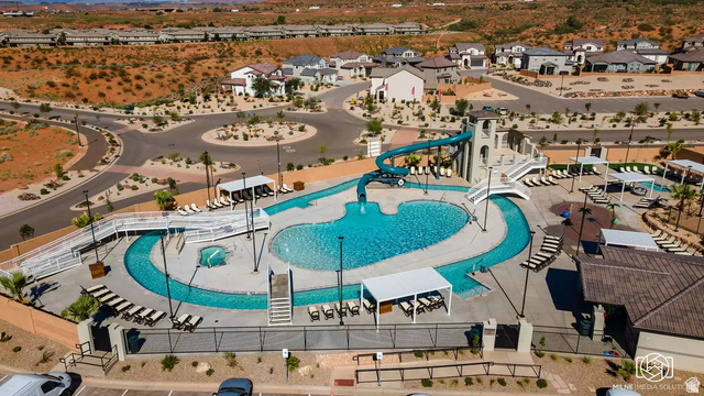 1166 North Riviera Alley Washington, UT 84780 - Photo 21 of 26 Aerial view of residential area featuring a pool
