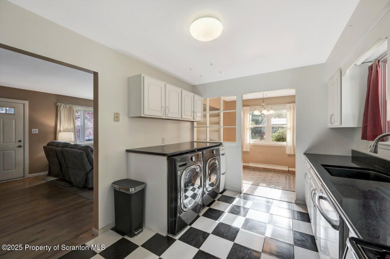 524 Knapp Road Clarks Summit, PA 18411 - Photo 14 of 45 a kitchen with granite countertop a stove a sink and a refrigerator
