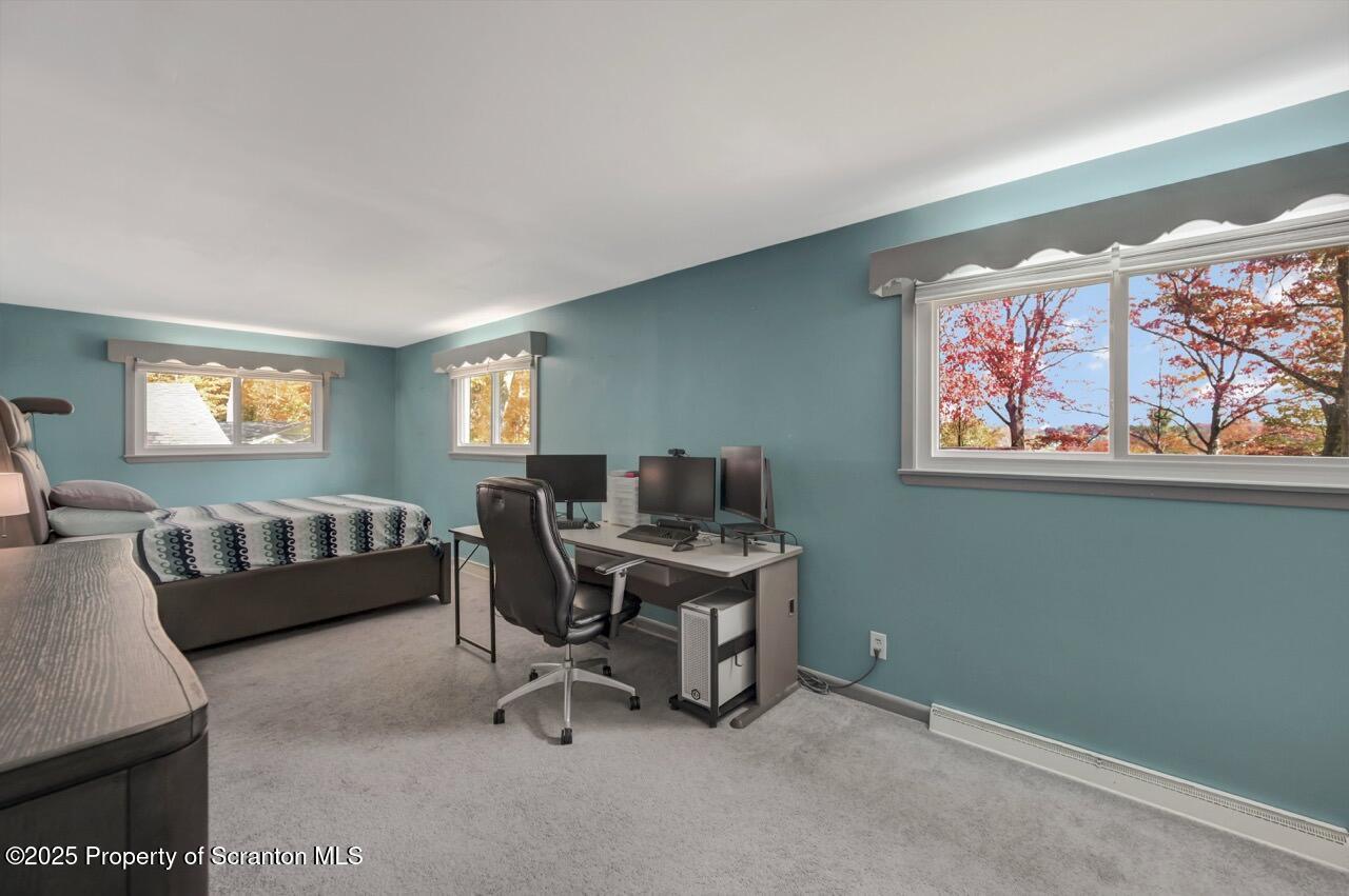 524 Knapp Road Clarks Summit, PA 18411 - Photo 19 of 45 a view of a livingroom with workspace and a couch