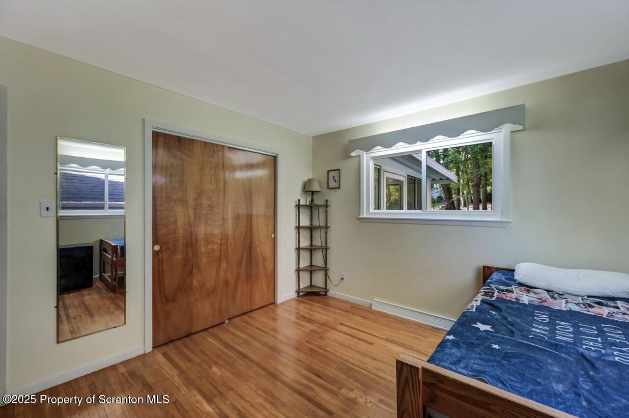 524 Knapp Road Clarks Summit, PA 18411 - Photo 25 of 45 a view of a livingroom with wooden floor and closet