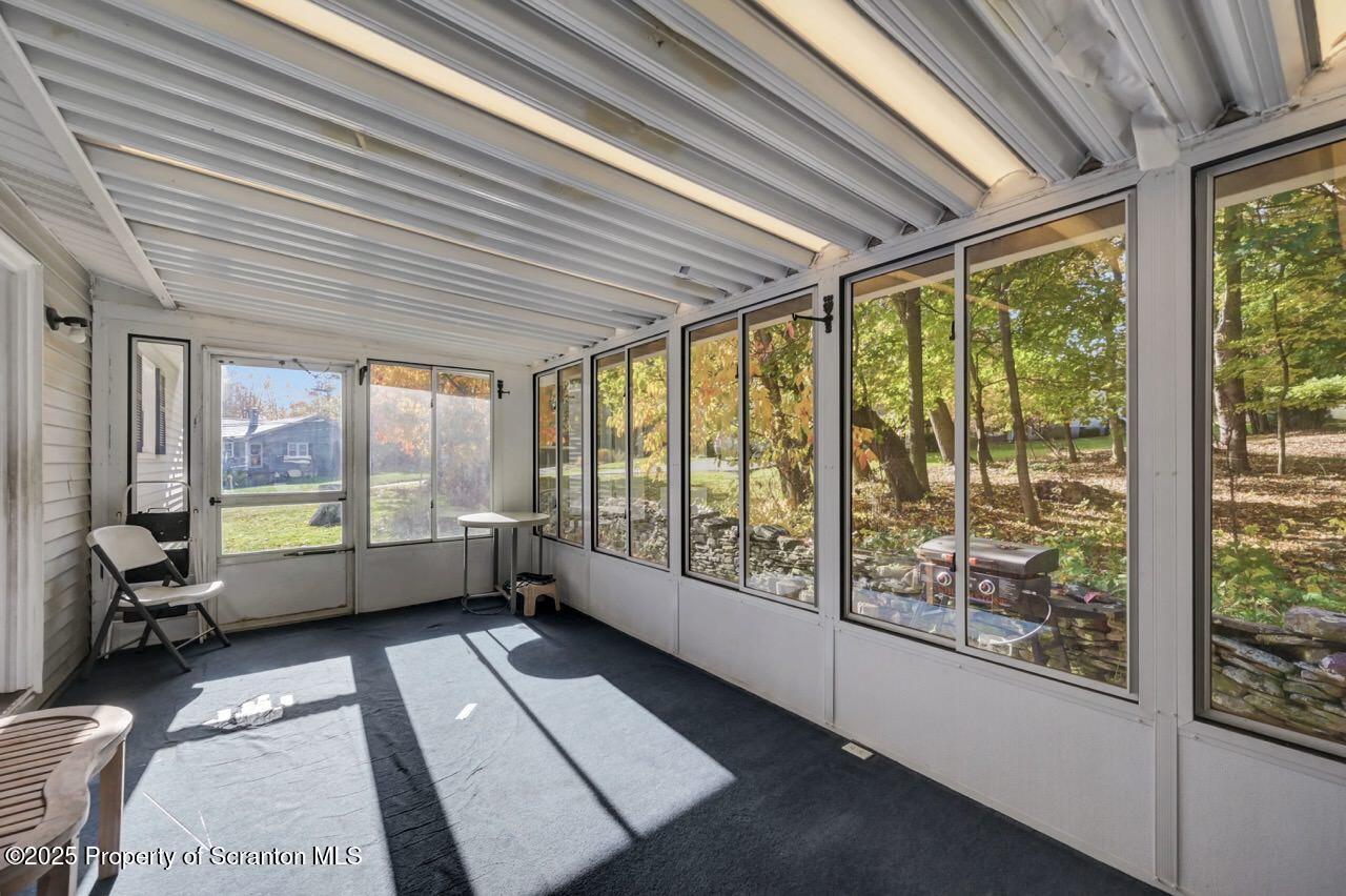 524 Knapp Road Clarks Summit, PA 18411 - Photo 28 of 45 a room with large windows and furniture