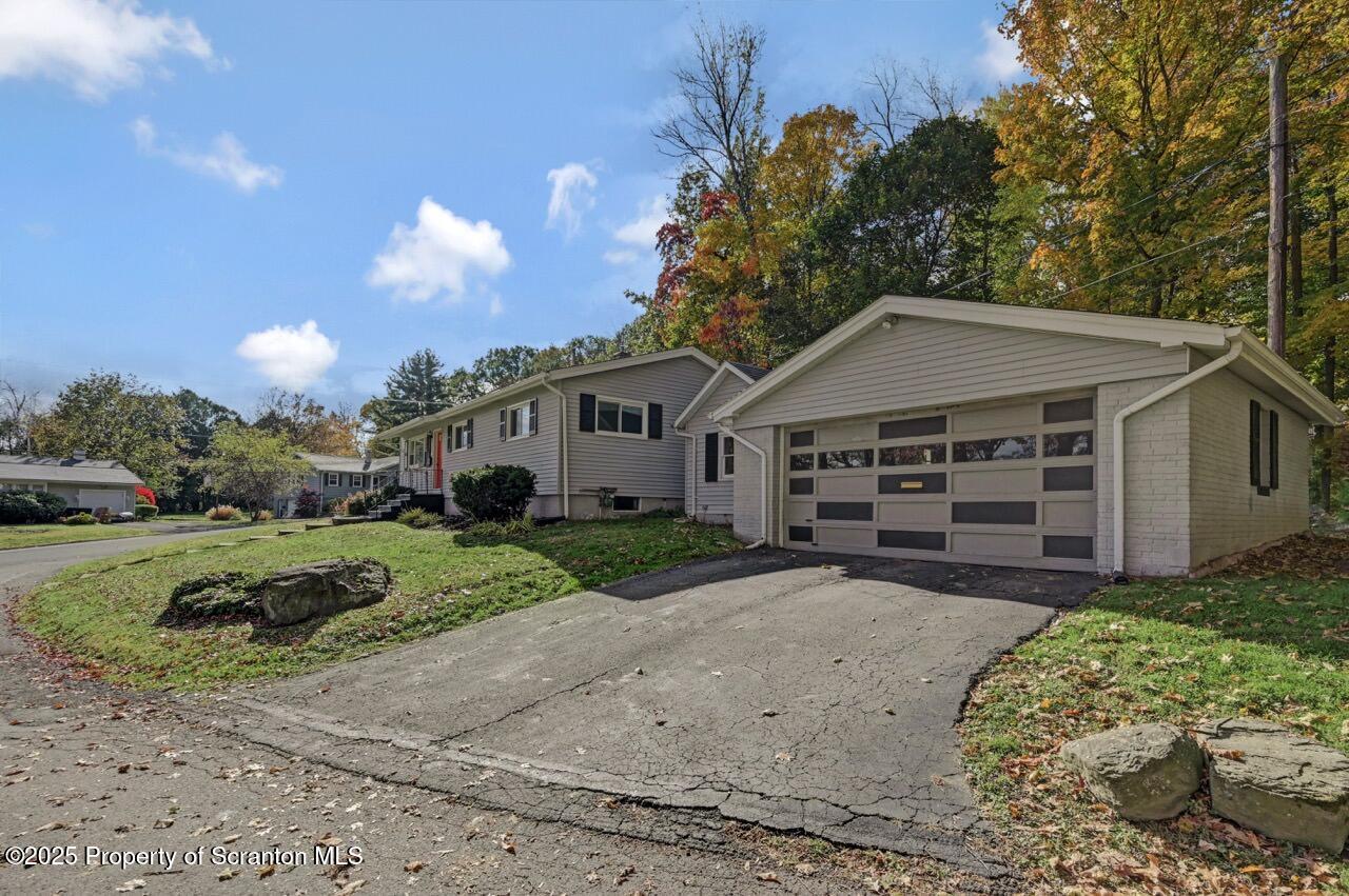 524 Knapp Road Clarks Summit, PA 18411 - Photo 3 of 45 a view of a house with a small yard and a large tree
