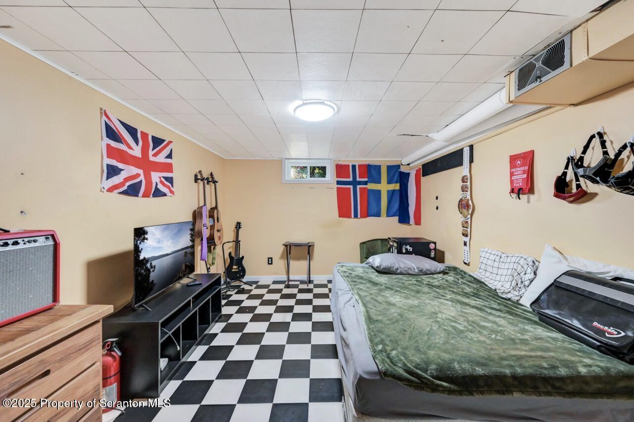 524 Knapp Road Clarks Summit, PA 18411 - Photo 32 of 45 a room with furniture and a flat screen tv