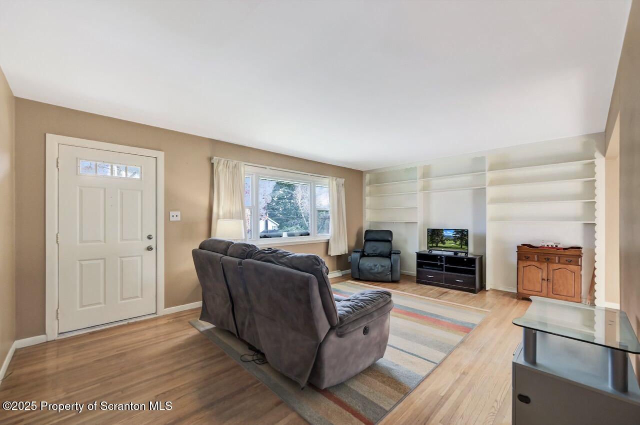524 Knapp Road Clarks Summit, PA 18411 - Photo 4 of 45 a living room with furniture and a fireplace