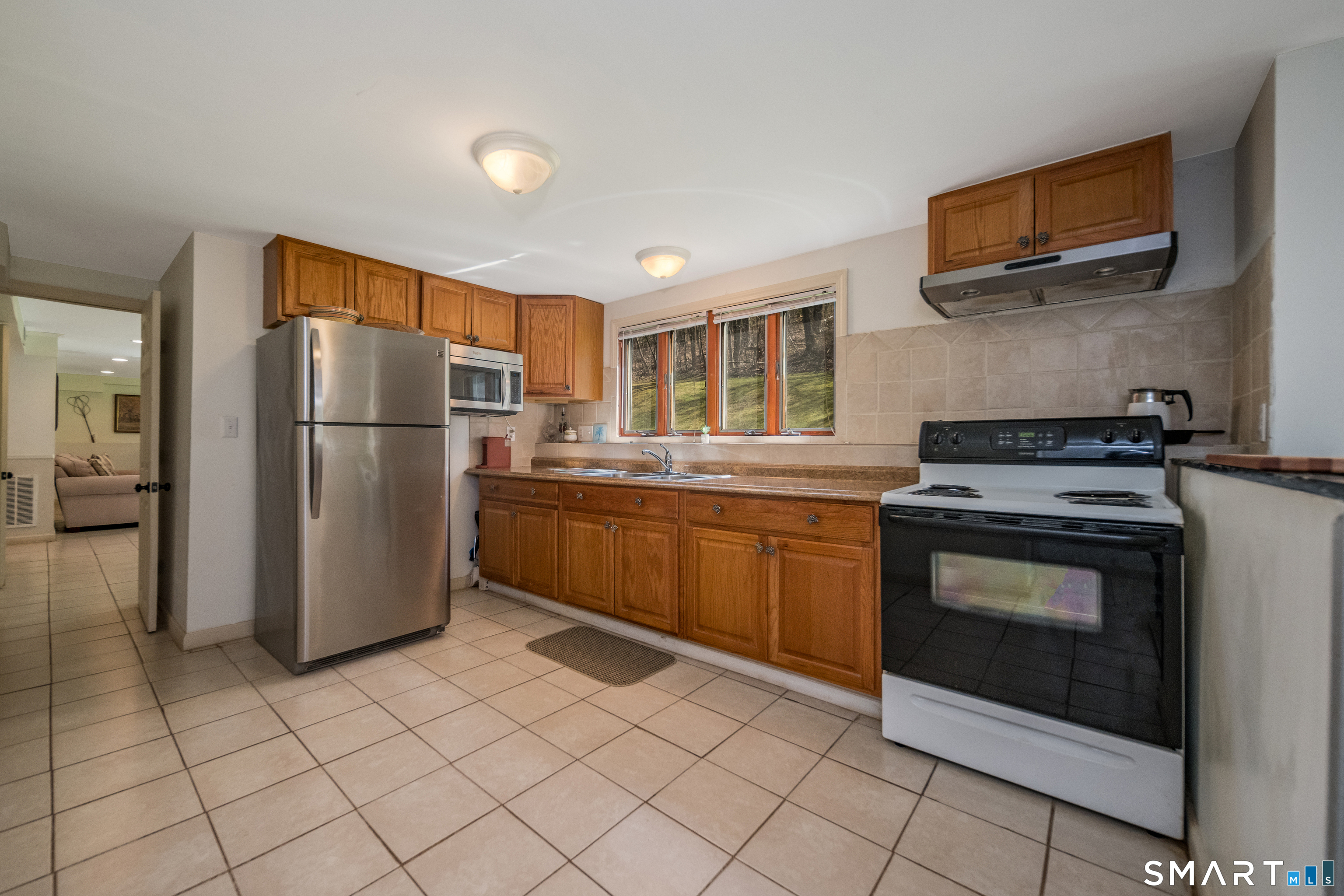 408 R Stage Coach Road Durham, CT 06422 - Photo 19 of 40 a kitchen with a refrigerator sink and cabinets