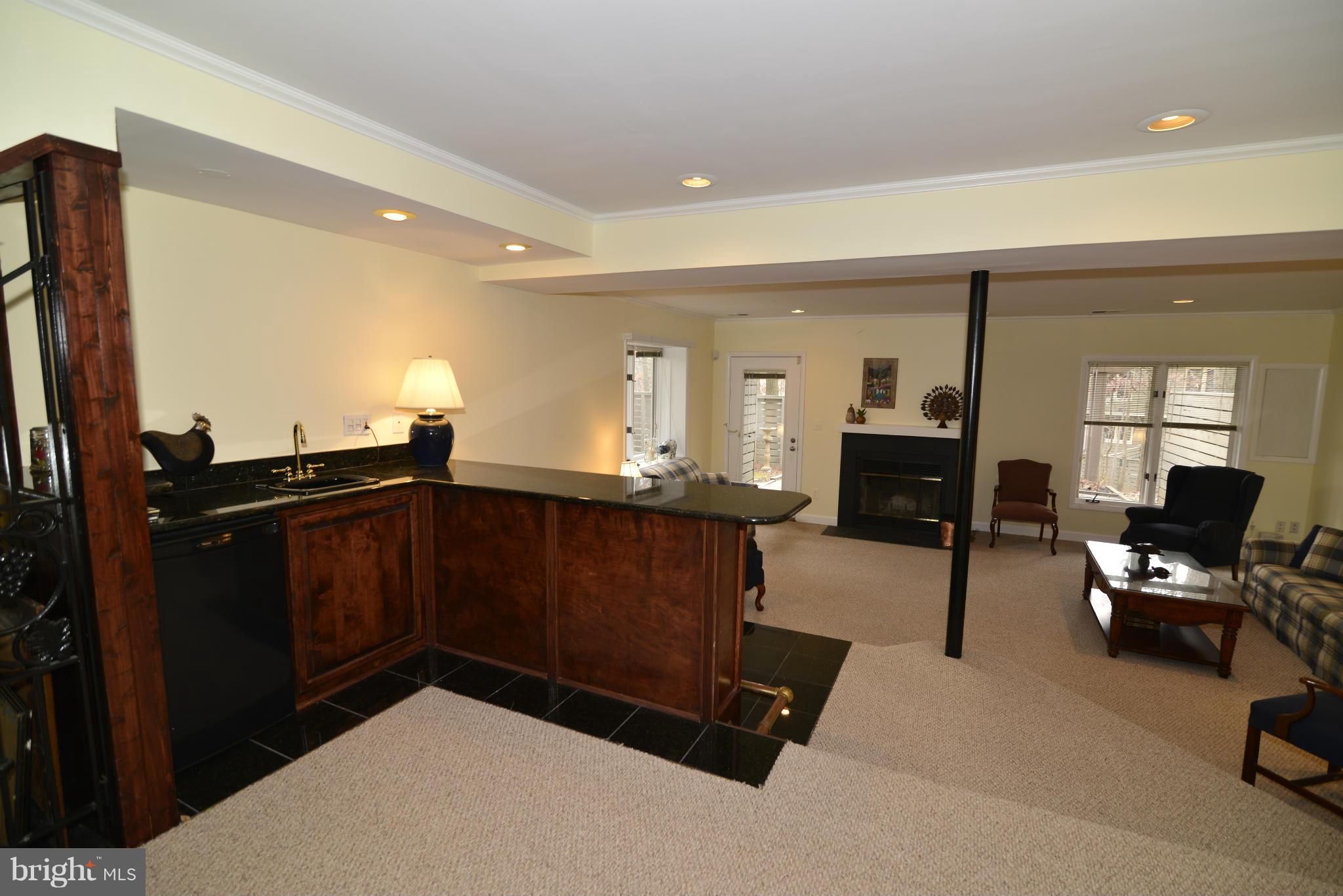11100 Lakespray Way Reston, VA 20191 - Photo 26 of 29 The lower level has a wet bar w/a granite counter.
