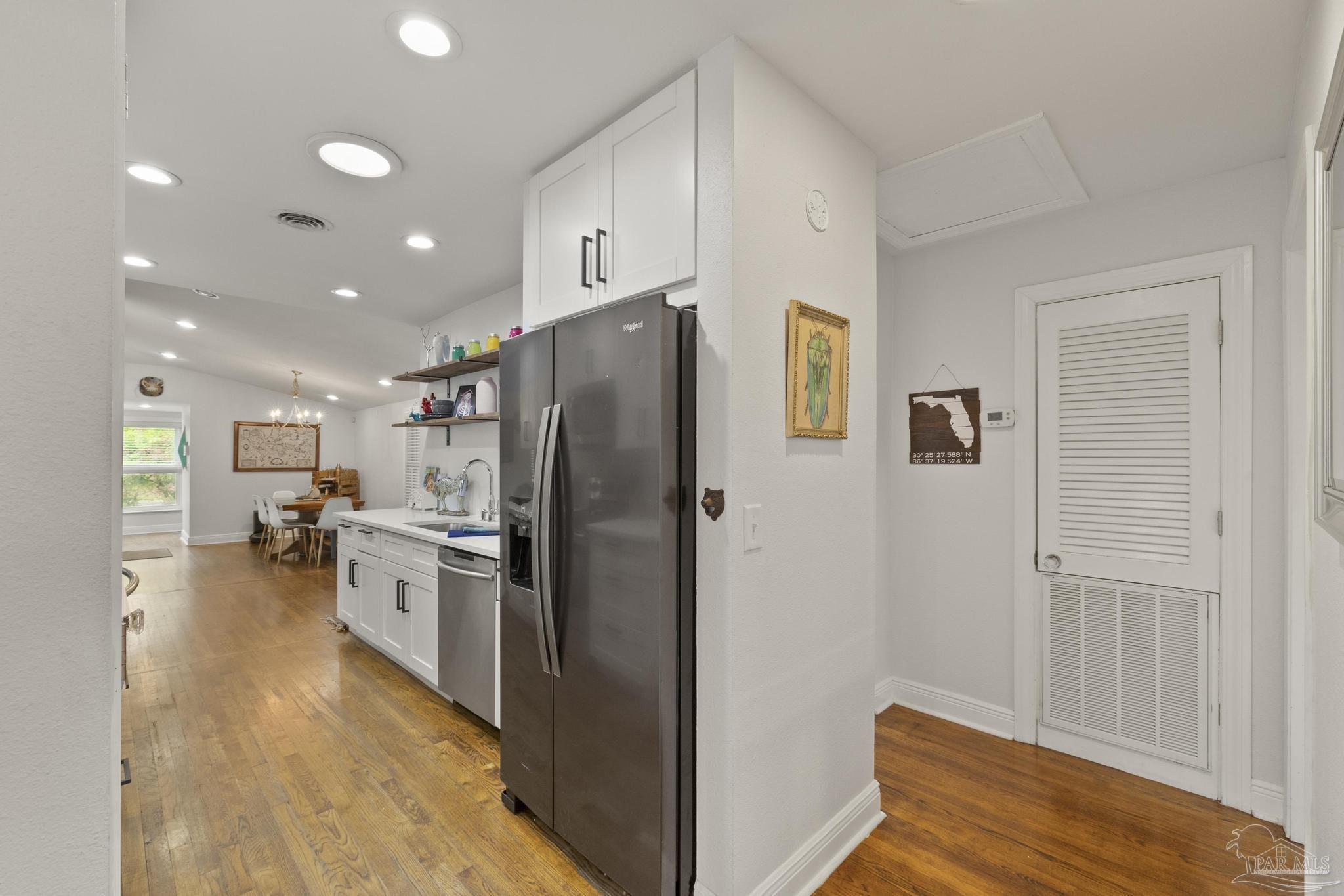 200 Clematis Street Pensacola, FL 32503 - Photo 12 of 33 a kitchen with a refrigerator and a sink