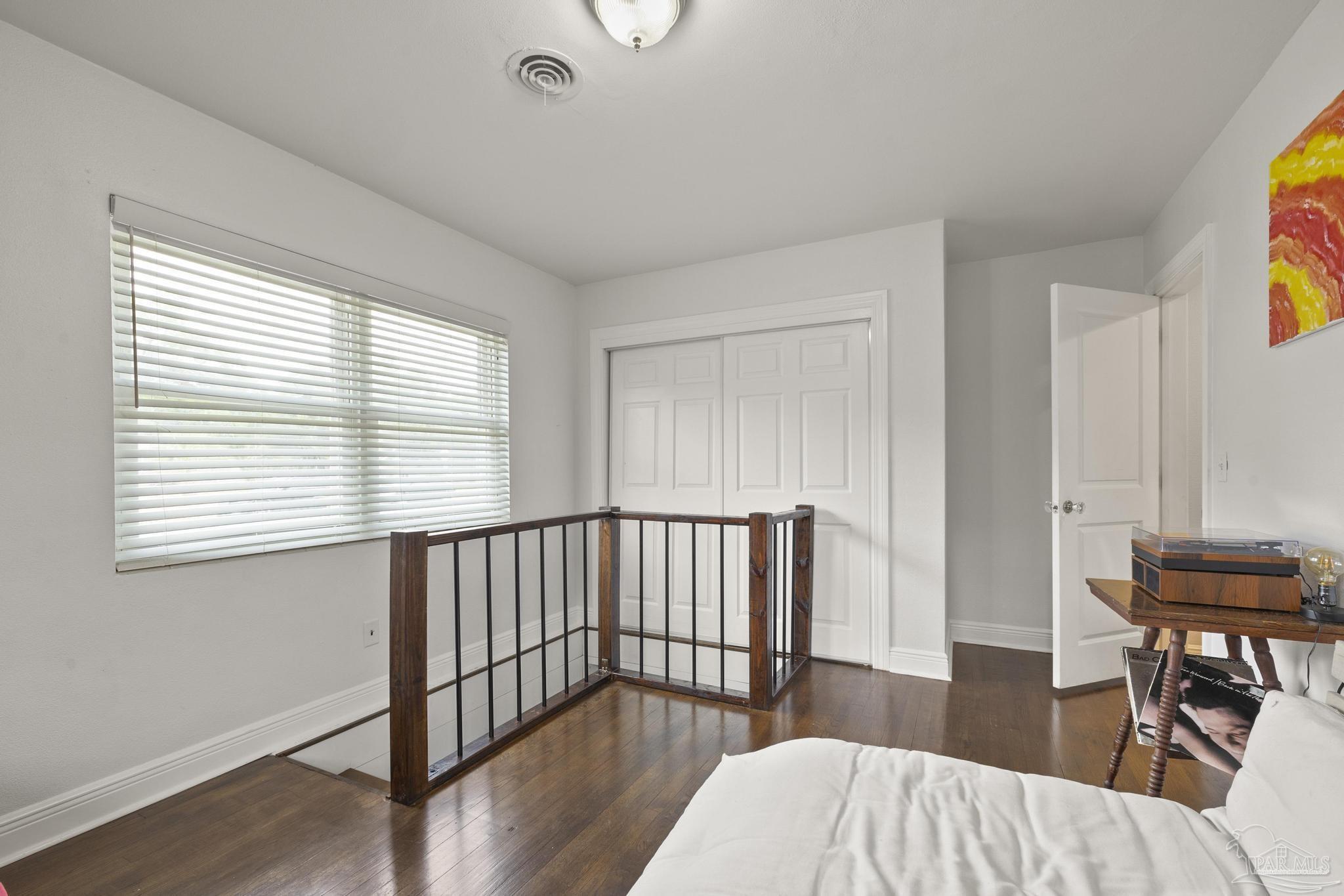 200 Clematis Street Pensacola, FL 32503 - Photo 15 of 33 a bedroom with furniture and a window