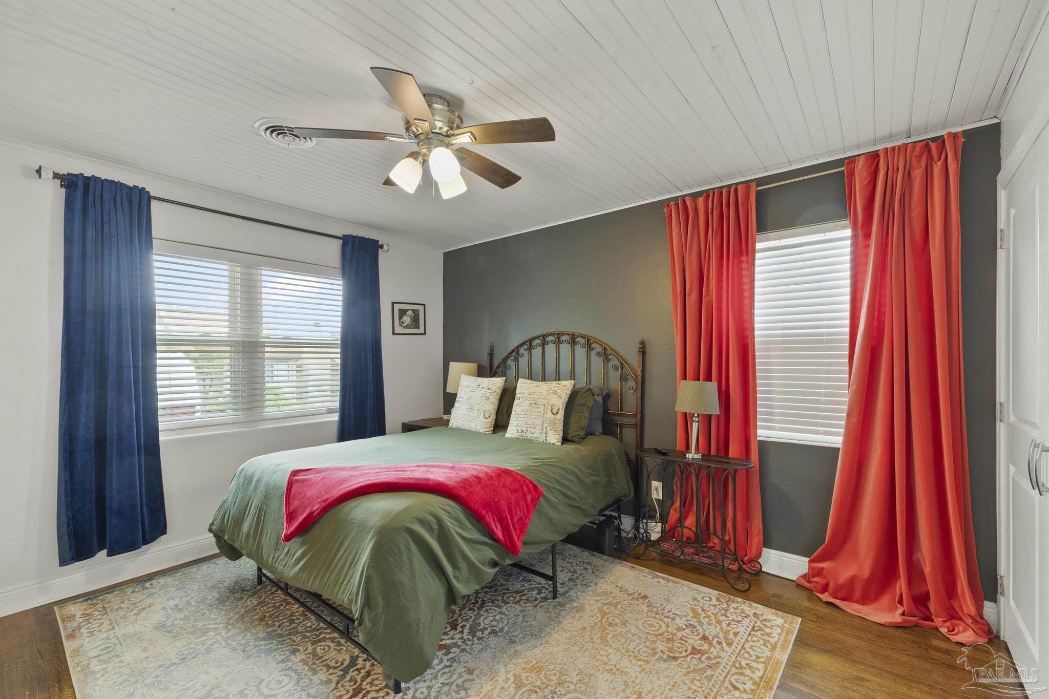 200 Clematis Street Pensacola, FL 32503 - Photo 18 of 33 a bedroom with a bed and a window