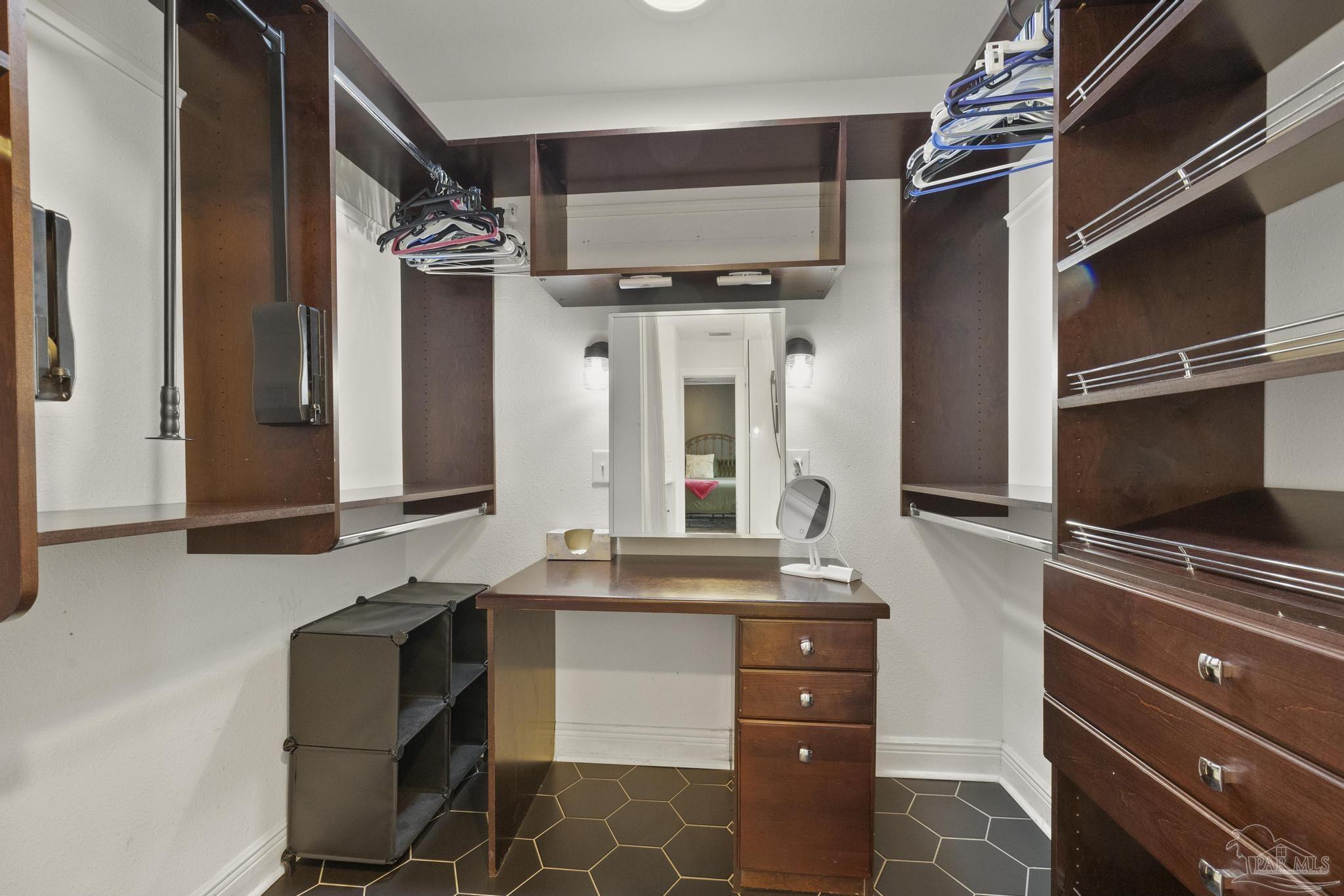 200 Clematis Street Pensacola, FL 32503 - Photo 21 of 33 a bathroom with a sink a mirror and a shower