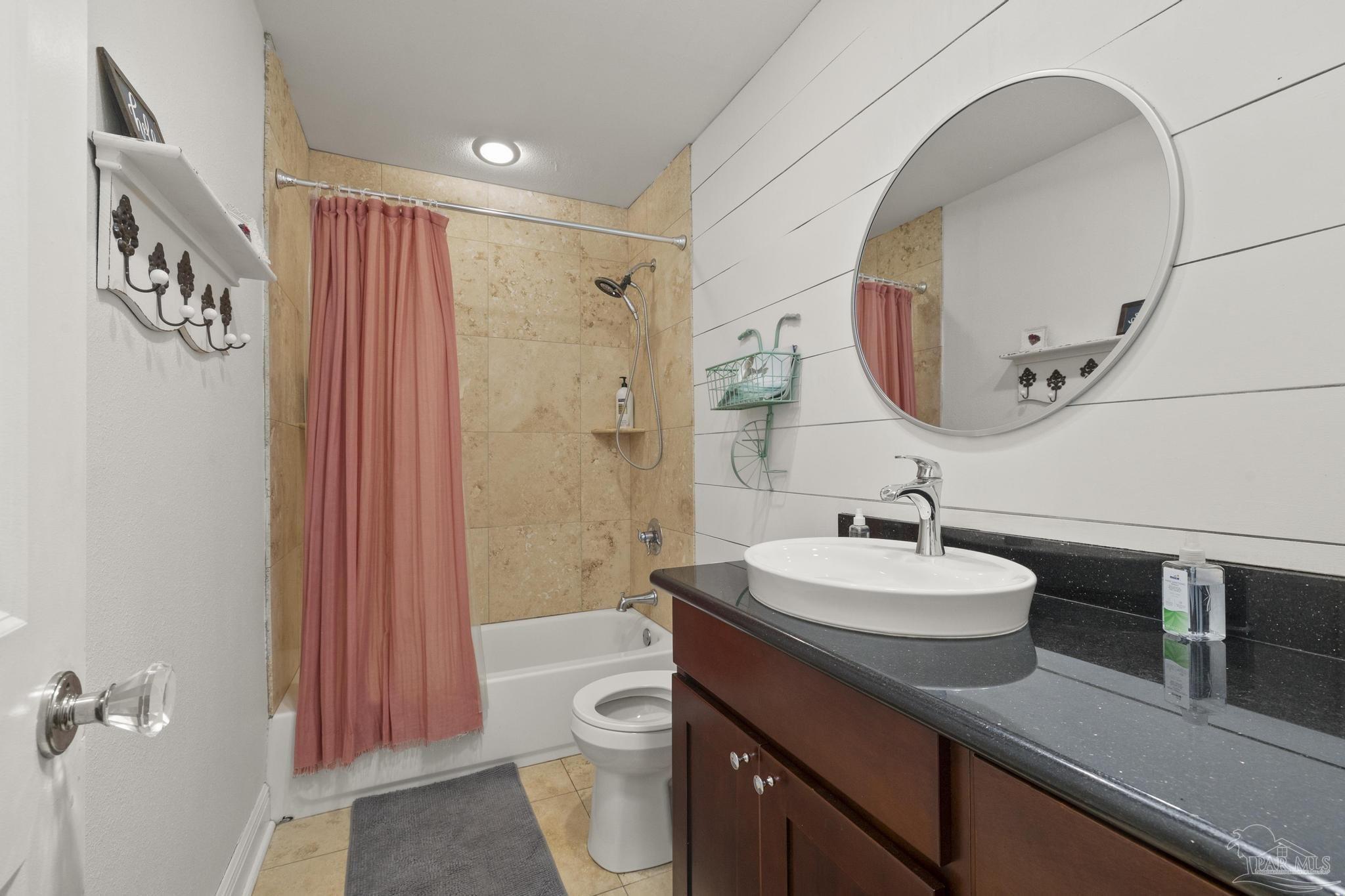 200 Clematis Street Pensacola, FL 32503 - Photo 23 of 33 a bathroom with a sink a toilet and shower