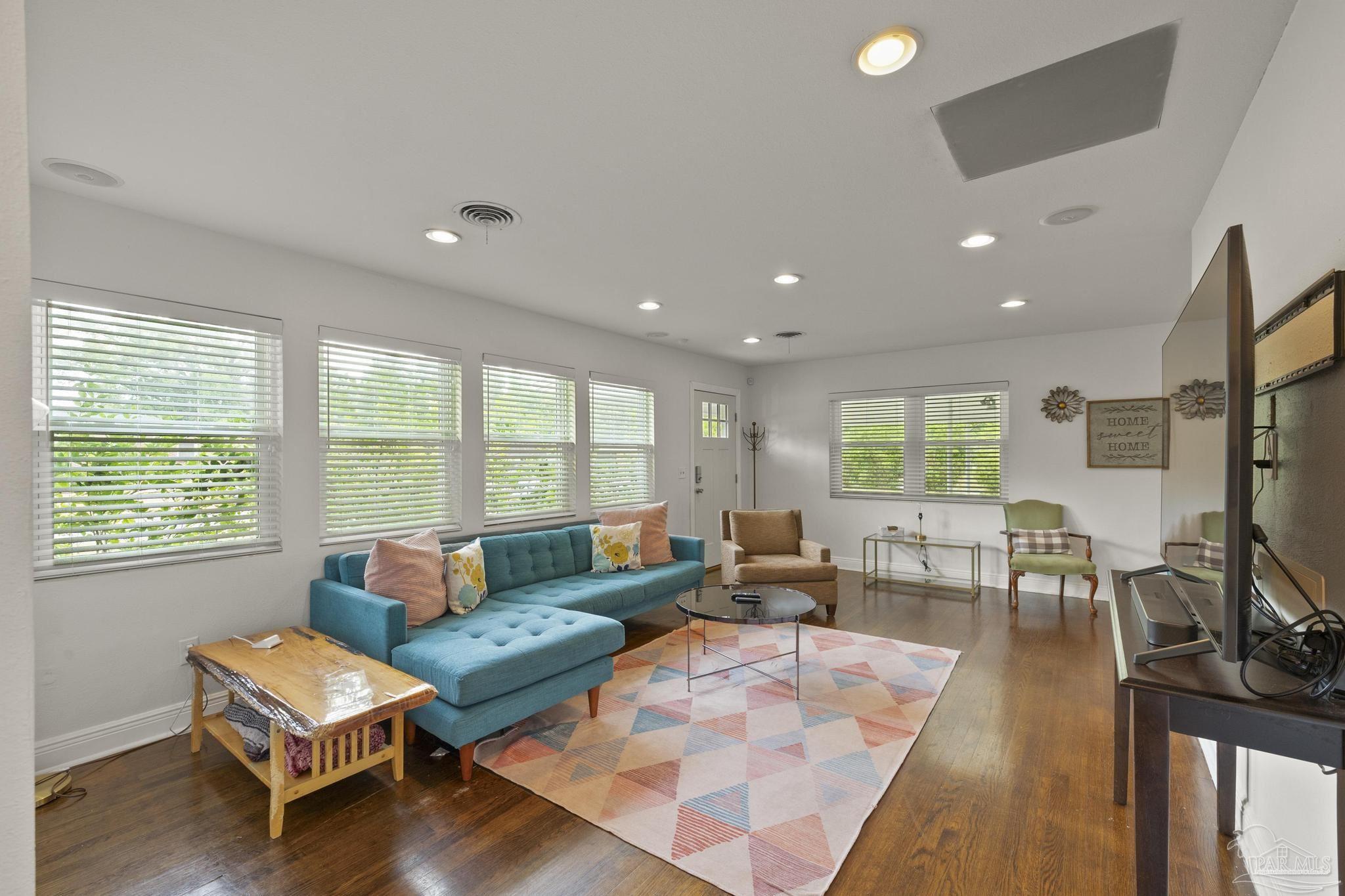 200 Clematis Street Pensacola, FL 32503 - Photo 4 of 33 a living room with furniture and a flat screen tv