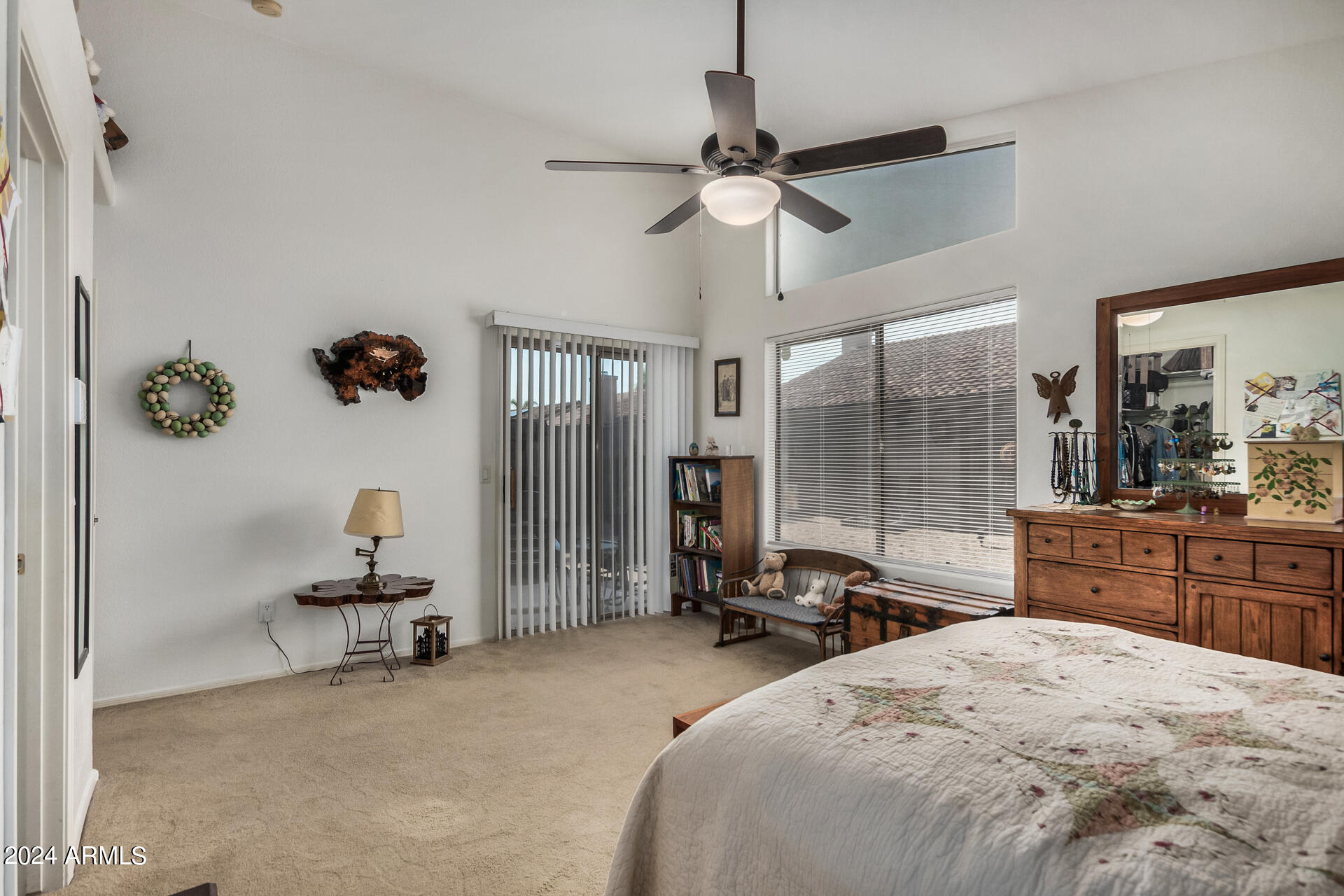 9124 West Calavar Road Peoria, AZ 85381 - Photo 14 of 25 a bed room with a bed and a large mirror