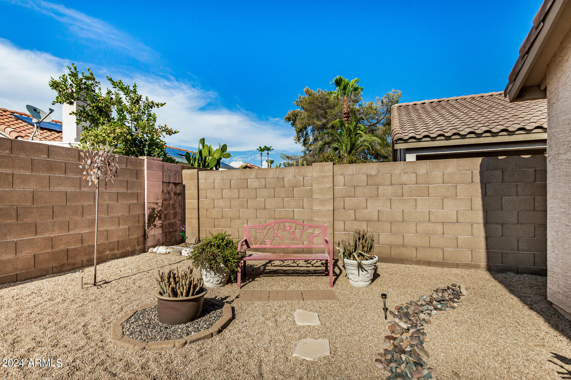 9124 West Calavar Road Peoria, AZ 85381 - Photo 24 of 25 a view of a porch with potted plants