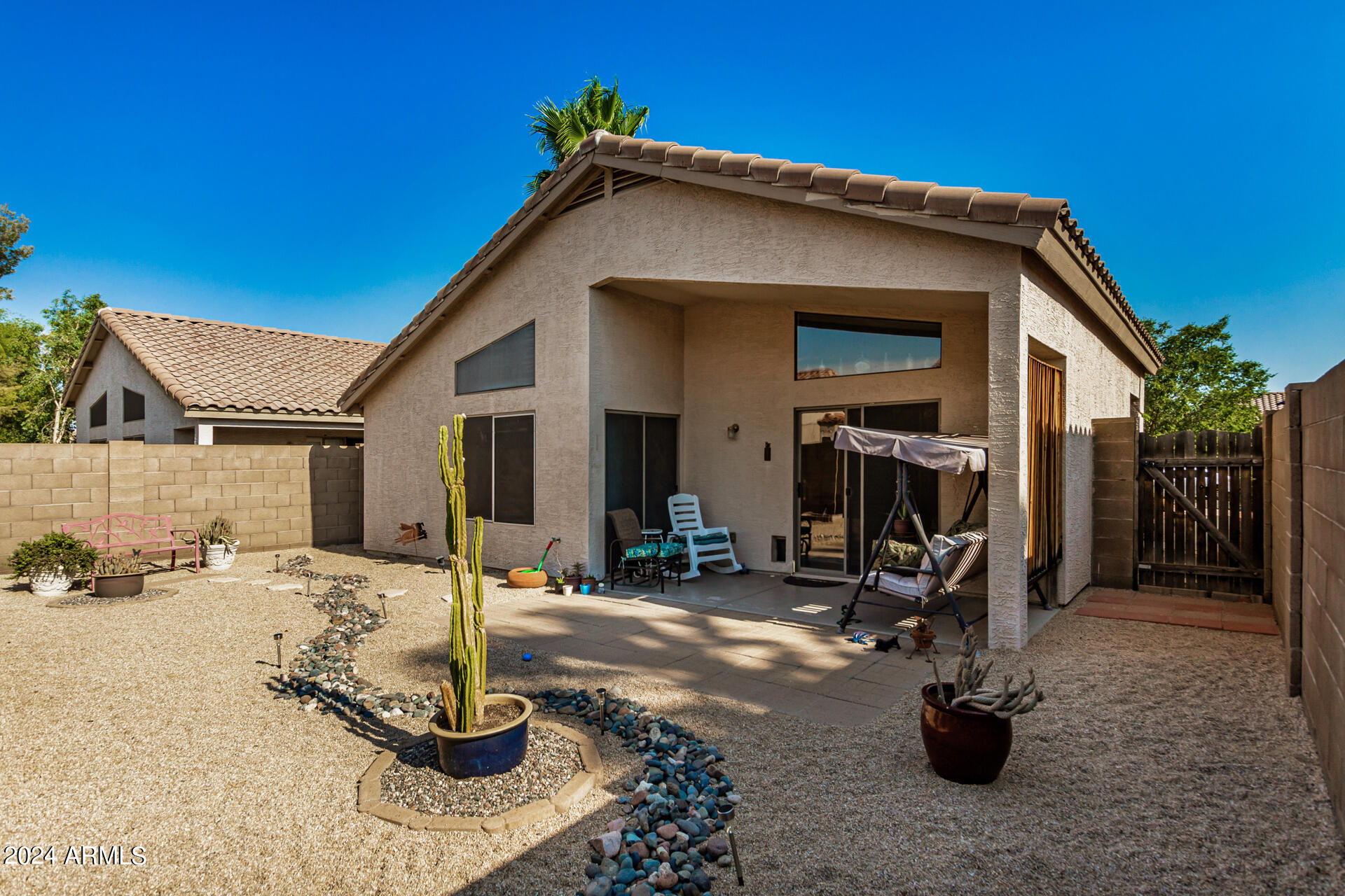 9124 West Calavar Road Peoria, AZ 85381 - Photo 10 of 25 a view of a house with patio