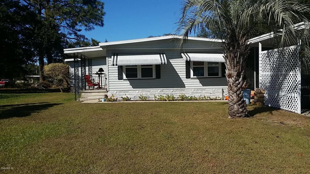 5751 Southwest 63rd Lane Road Ocala, FL 34474 - Photo 1 of 1 Bri Front