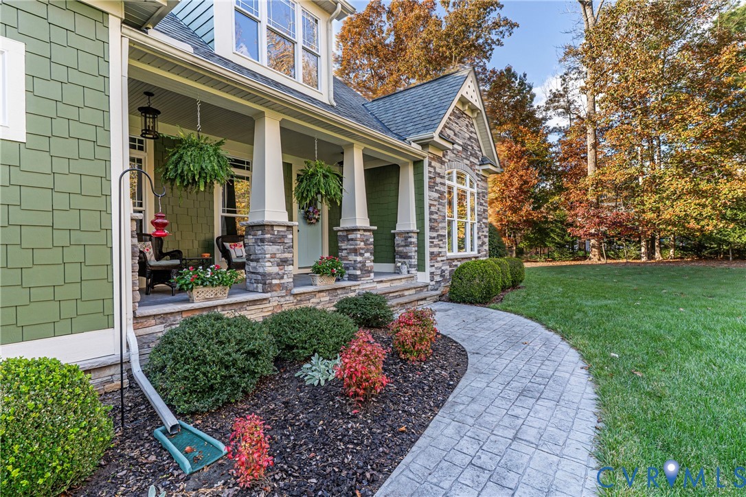 11630 Barrows Ridge Lane Chesterfield, VA 23838 - Photo 49 of 50 a front view of a house with garden and plants