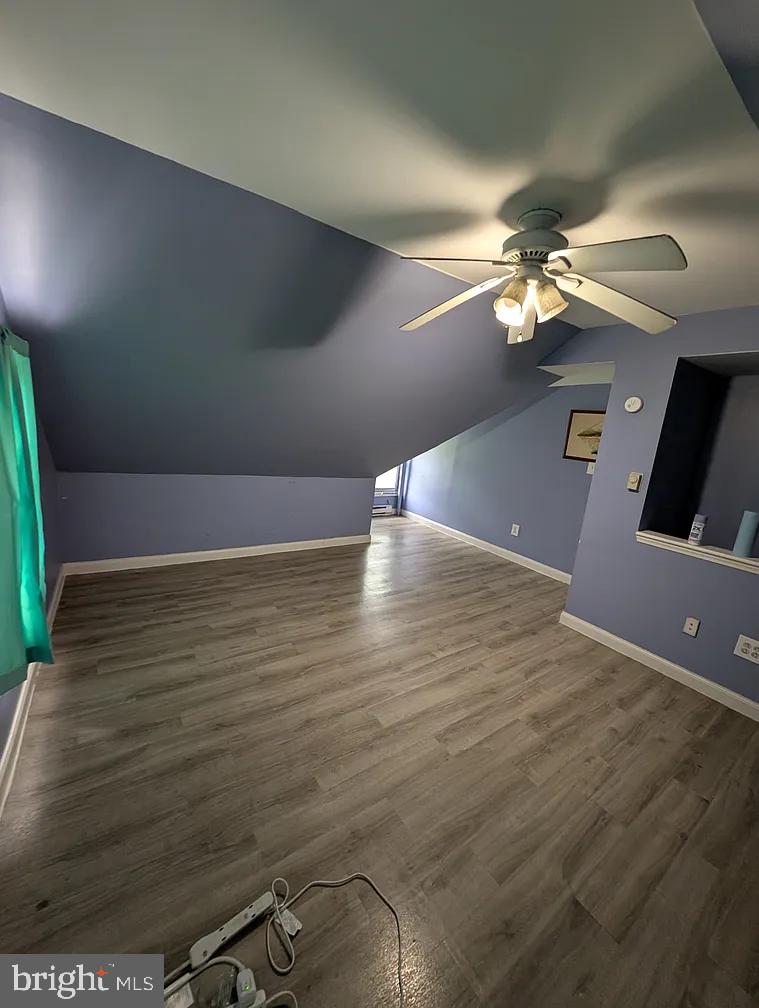 1226 Haycreek Road Birdsboro, PA 19508 - Photo 14 of 16 a view of a room with a ceiling fan and wooden floor