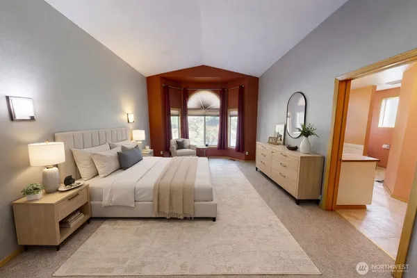a bed room with a bed and a large window