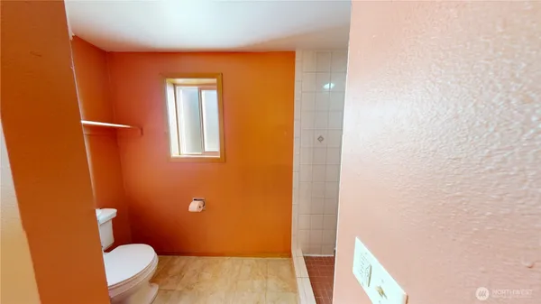 a bathroom with a toilet