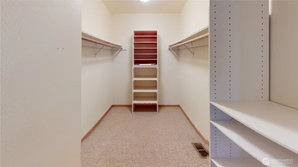 a view of an empty room with stairs and ventilation