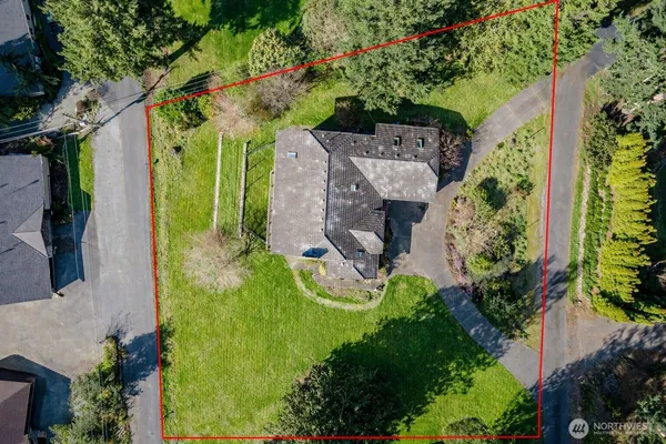 an aerial view of a house with a garden