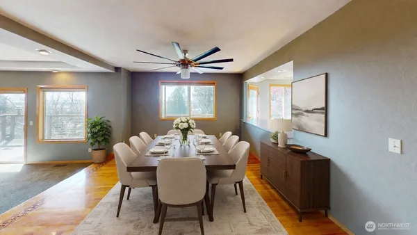a view of a dining room with furniture and window