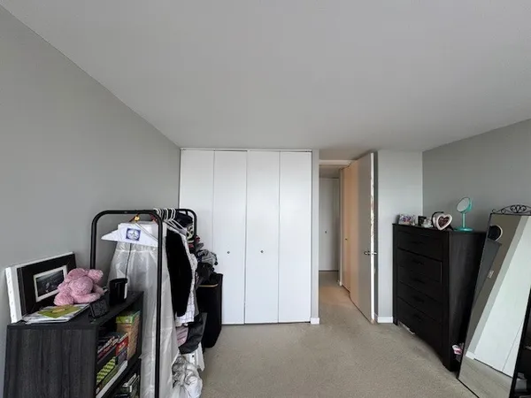 a view of a workspace with furniture and closet