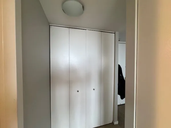 a bathroom with a glass shower door