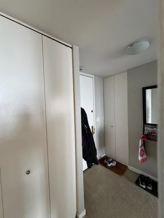 a view of a room with storage and utility room