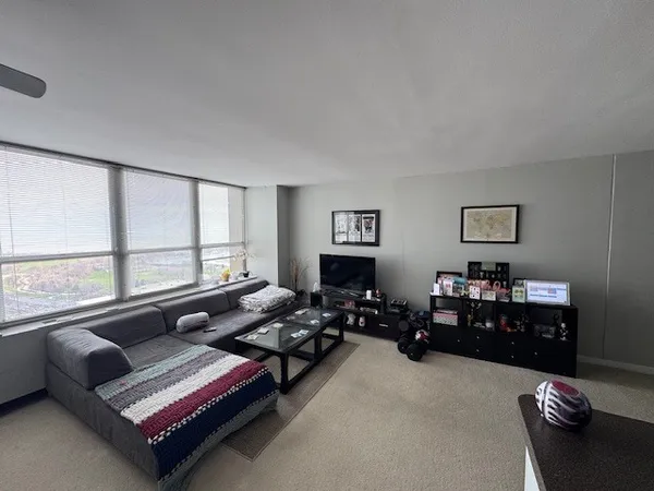 a living room with furniture and a window