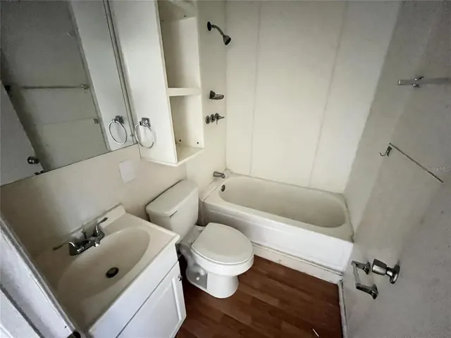 a bathroom with a sink and toilet