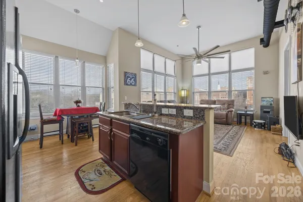 a kitchen with a stove a sink and a refrigerator