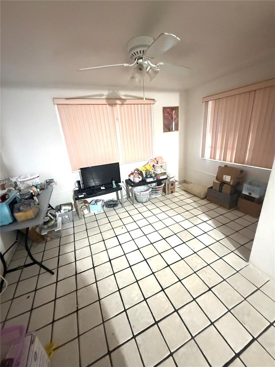 5181 Northwest 5th Street Miami, FL 33126 - Photo 3 of 8 a bedroom with a bed and a window