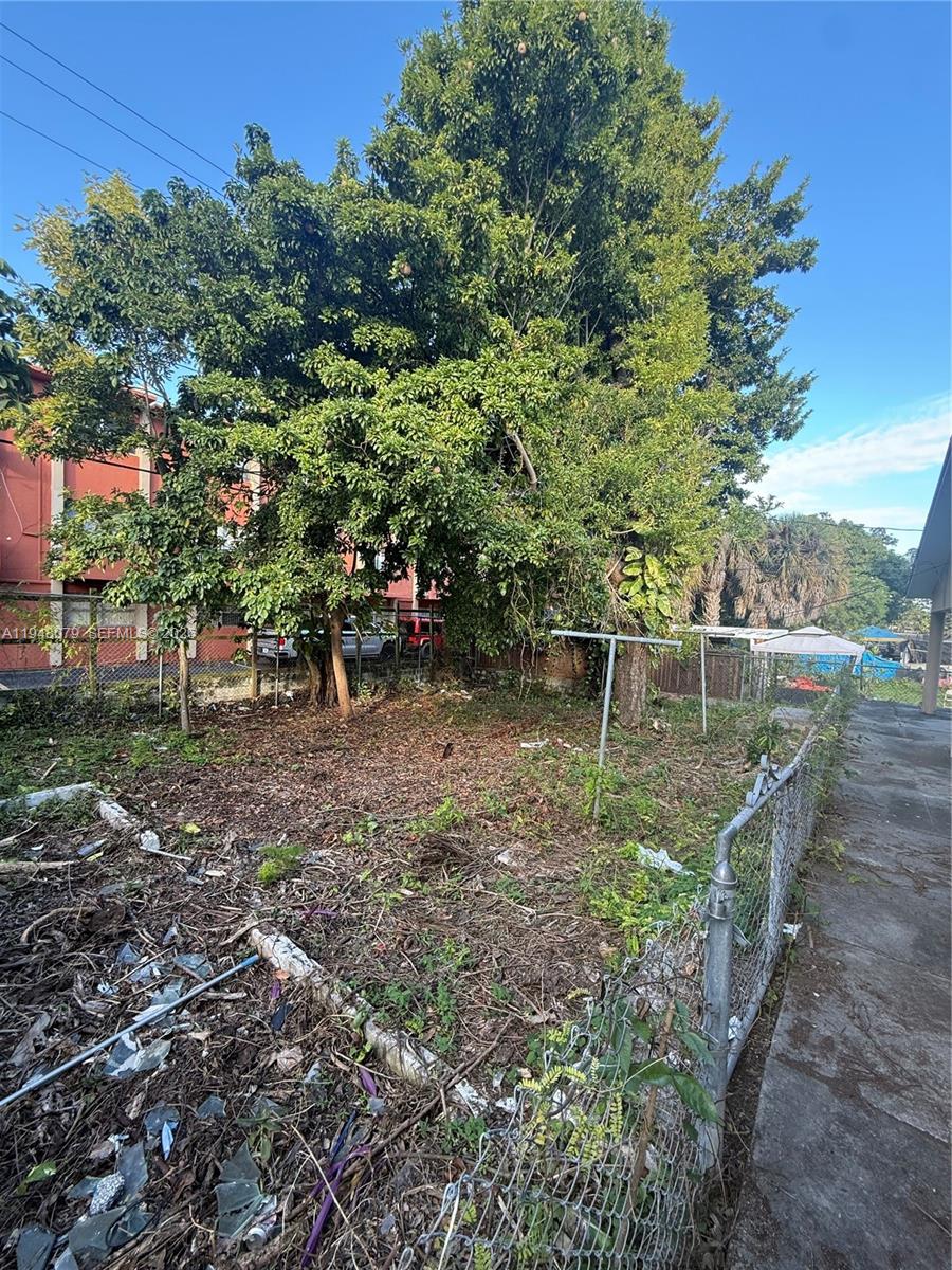 5181 Northwest 5th Street Miami, FL 33126 - Photo 8 of 8 a backyard of a house with table and chairs